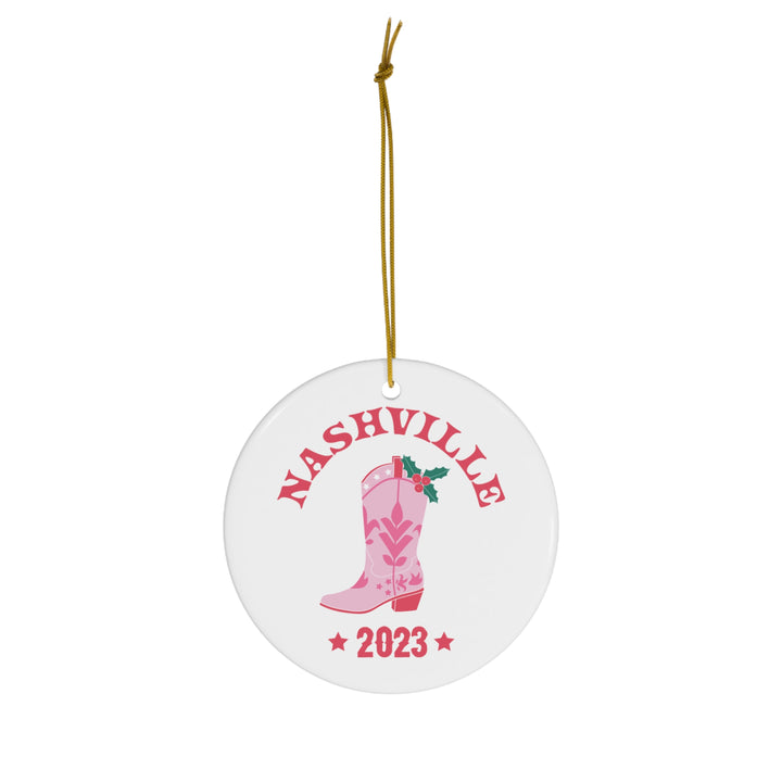 Vibrant pink Nashville 2023 Cowgirl Boot Ornament featuring festive holly leaves, perfect for Nashville and country music lovers!