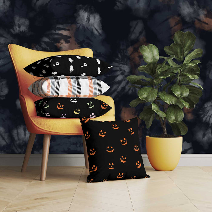 Halloween-themed graphic pillow cover featuring vibrant designs like jack-o-lanterns, spooky cats, skeletons, and skulls, made from soft spun polyester for festive seasonal decor.
